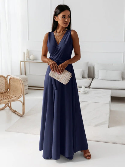 Long-sleeve maxi dress with a wrap design, featuring a flowing silhouette and a modest neckline. 5