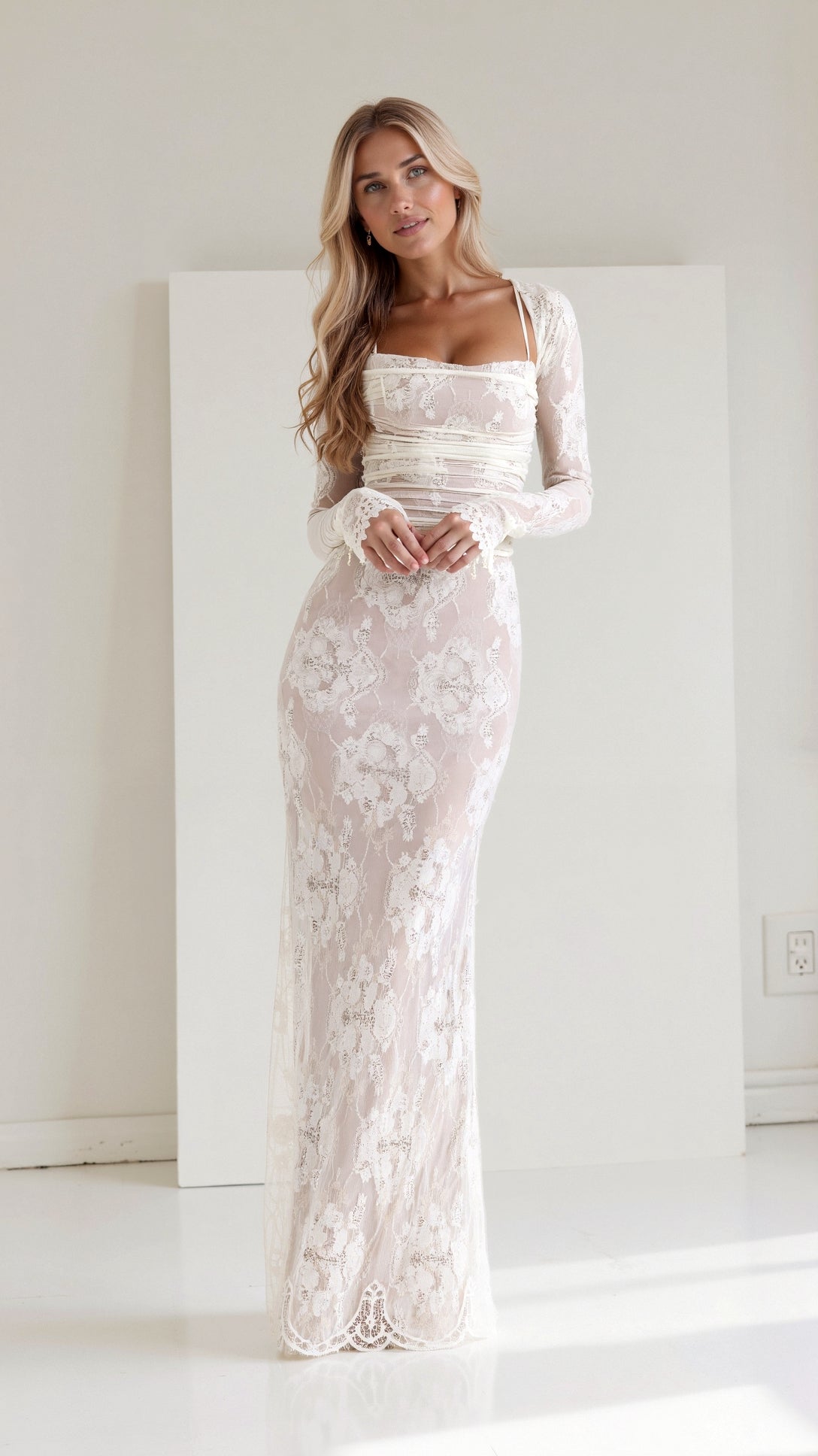 A long, floral-patterned dress with a corset-style bodice, designed for formal events such as weddings. The dress features lace details and a 1