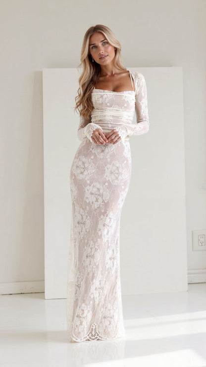 A long, floral-patterned dress with a corset-style bodice, designed for formal events such as weddings. The dress features lace details and a 1
