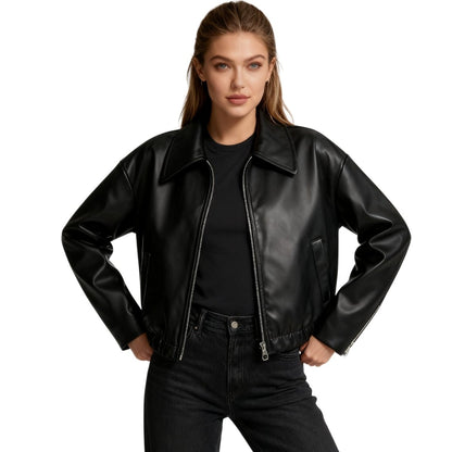 Short oversized bomber jacket for women made of faux leather, featuring a zippered front and ribbed cuffs. The jacket has a relaxed fit and a stylish 0