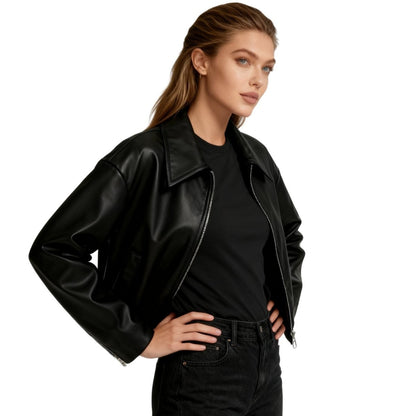 Short oversized bomber jacket for women made of faux leather, featuring a zippered front and ribbed cuffs. The jacket has a relaxed fit and a stylish 1