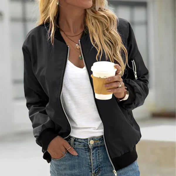 Women’s bomber jacket with a zipper and elastic cuffs, featuring a fitted silhouette and a casual design. 0