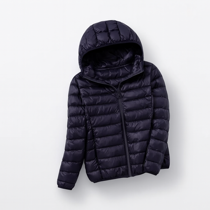 Women's puffer jacket with a hood, designed for cold weather, featuring a zip closure and side pockets. 13