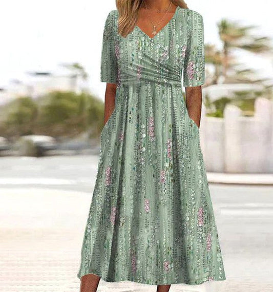 A-line summer dress with a floral pattern, featuring a lightweight and breezy design, suitable for warm weather. 0