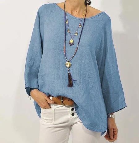 Loose women's long-sleeve blouse with a round neckline, featuring a relaxed fit and elegant design. 3