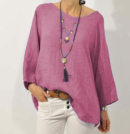 Loose women's long-sleeve blouse with a round neckline, featuring a relaxed fit and elegant design. 4