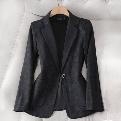 Women's fitted plaid blazer with elegant detailing. 2