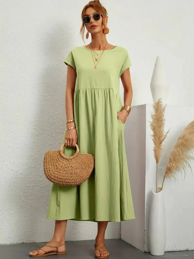 Maxi dress for women with short sleeves, featuring an A-line silhouette and a relaxed fit. 10