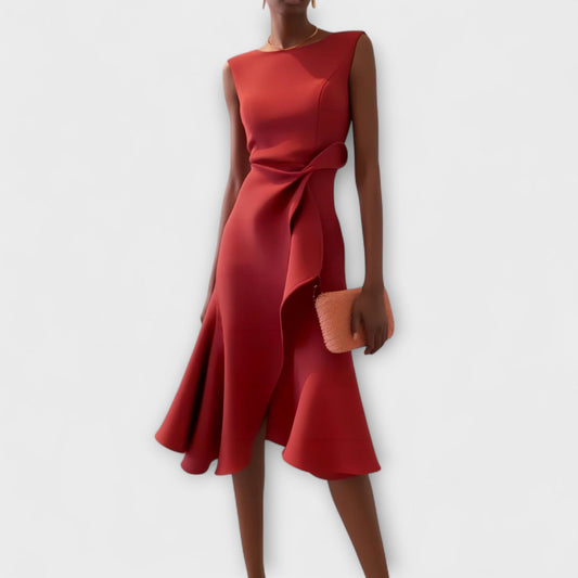 Dresses a midi length with asymmetrical draping, featuring a pleated design suitable for formal events. 0
