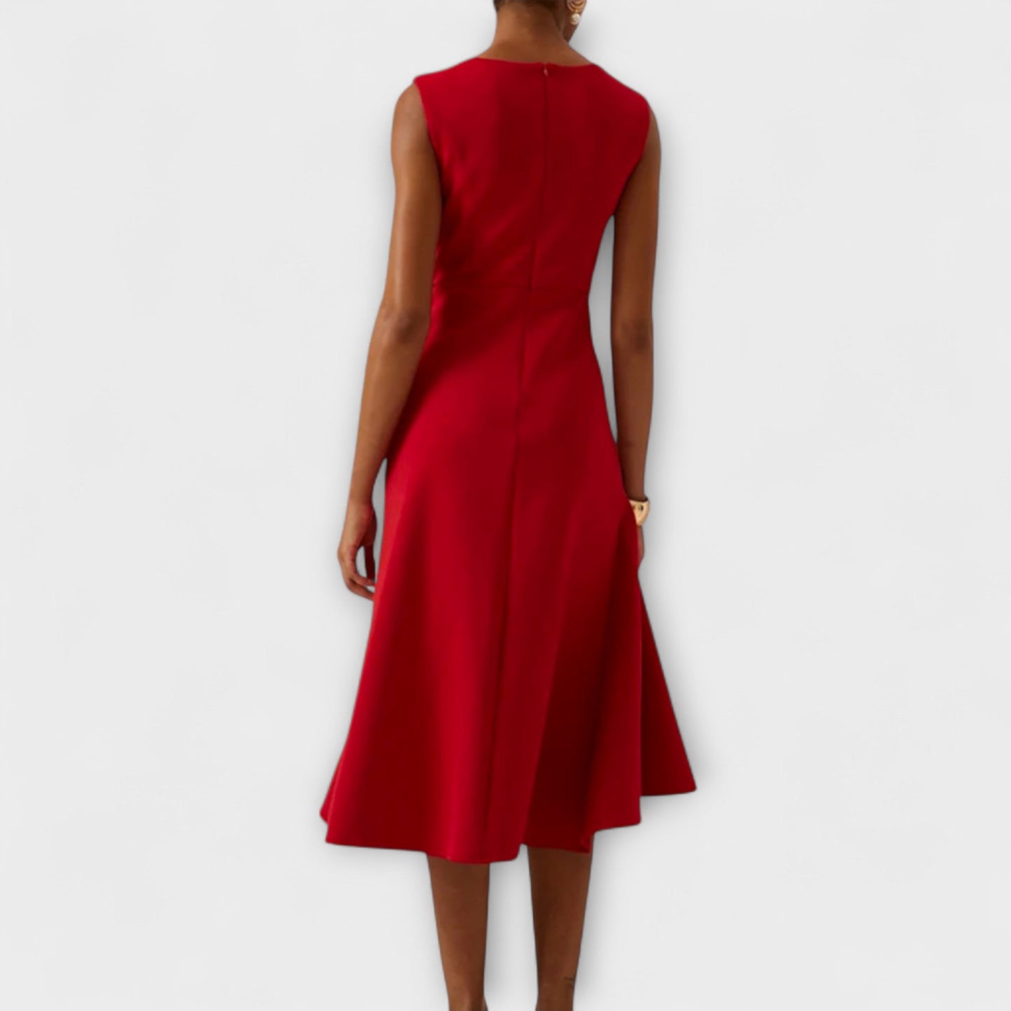 Dresses a midi length with asymmetrical draping, featuring a pleated design suitable for formal events. 1