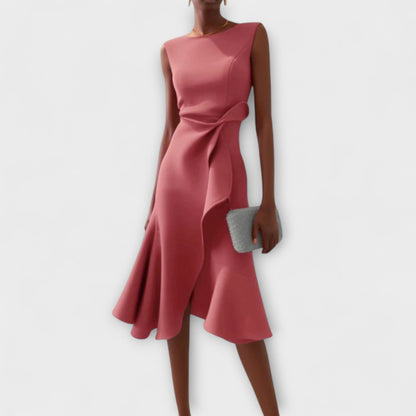 Dresses a midi length with asymmetrical draping, featuring a pleated design suitable for formal events. 3