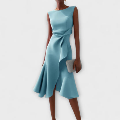 Dresses a midi length with asymmetrical draping, featuring a pleated design suitable for formal events. 4