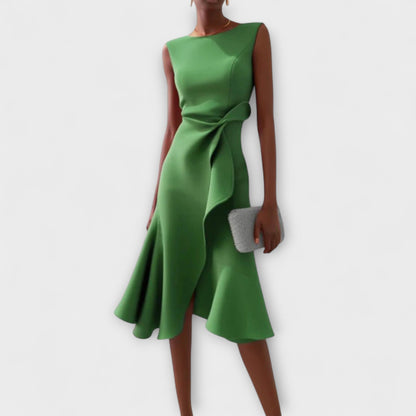 Dresses a midi length with asymmetrical draping, featuring a pleated design suitable for formal events. 6