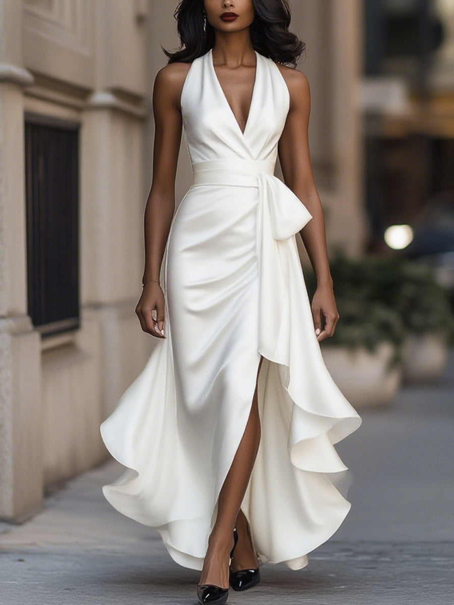 Dresses with a halter neckline and high-low hemline, featuring a flowing design and a feminine silhouette. 6