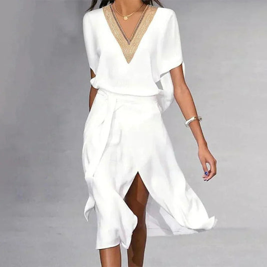 A women's dress featuring a V-neckline and a fitted silhouette, designed with short sleeves and a knee-length hem. 0