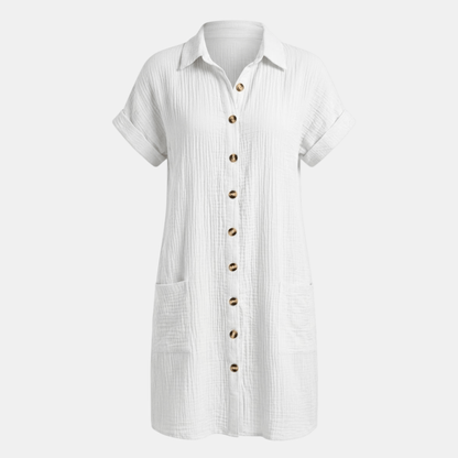 Dresses | A short-sleeved shirt dress featuring a button-down front and side pockets, designed for summer wear. 0