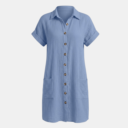 Dresses | A short-sleeved shirt dress featuring a button-down front and side pockets, designed for summer wear. 11