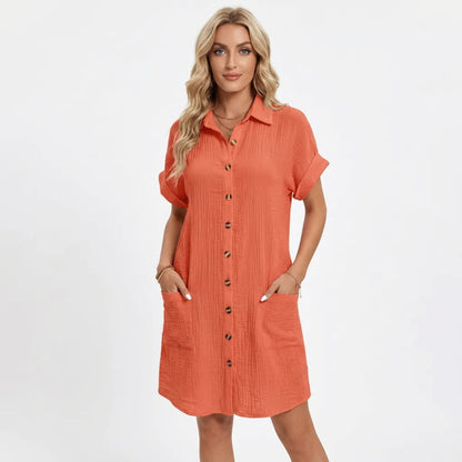 Dresses | A short-sleeved shirt dress featuring a button-down front and side pockets, designed for summer wear. 4