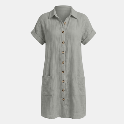 Dresses | A short-sleeved shirt dress featuring a button-down front and side pockets, designed for summer wear. 9