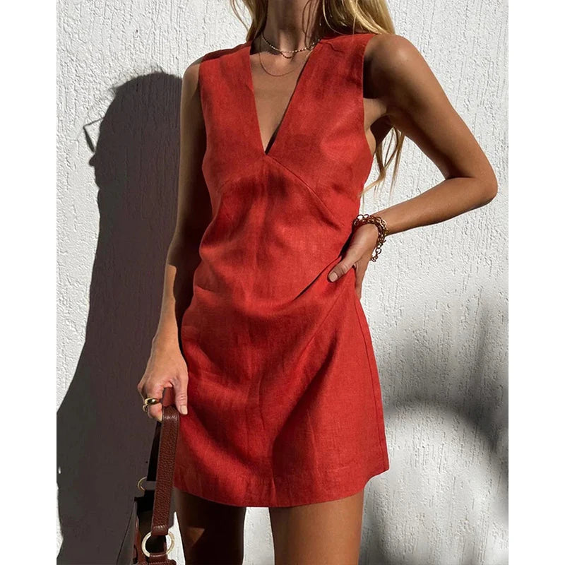 A sleeveless women's summer dress featuring a deep neckline, designed for warm weather wear. 0