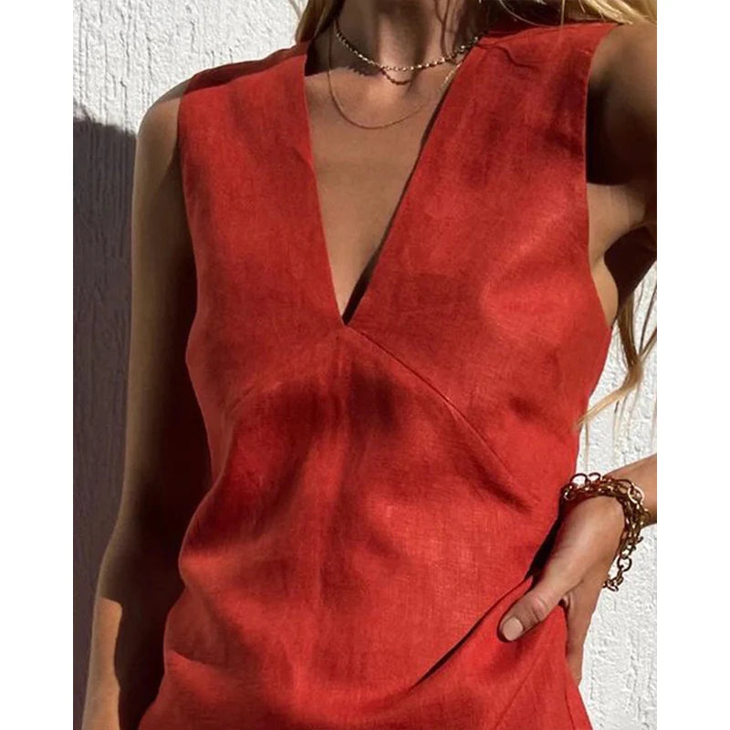 A sleeveless women's summer dress featuring a deep neckline, designed for warm weather wear. 1