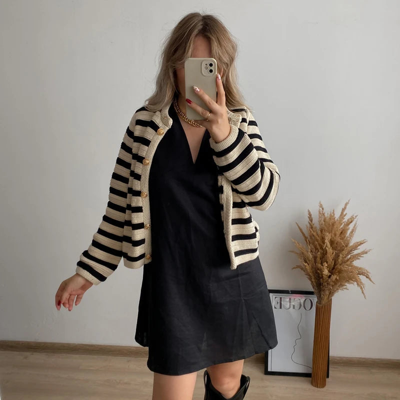 A sleeveless women's summer dress featuring a deep neckline, designed for warm weather wear. 5