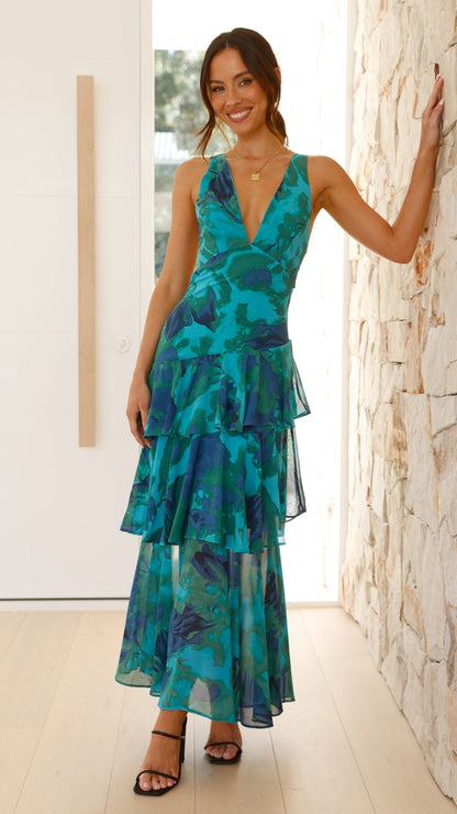 Maxi dress with a deep V-neckline, featuring a flowing silhouette and elegant design. 1