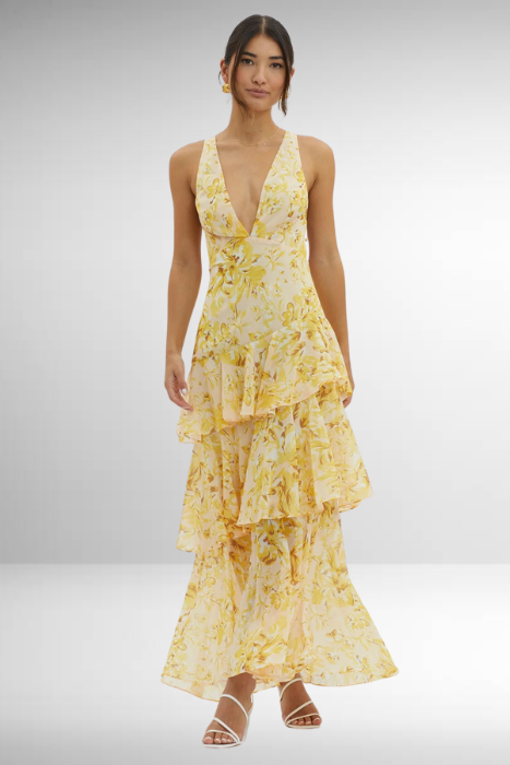 Maxi dress with a deep V-neckline, featuring a flowing silhouette and elegant design. 10