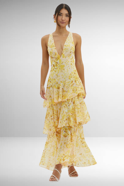 Maxi dress with a deep V-neckline, featuring a flowing silhouette and elegant design. 10