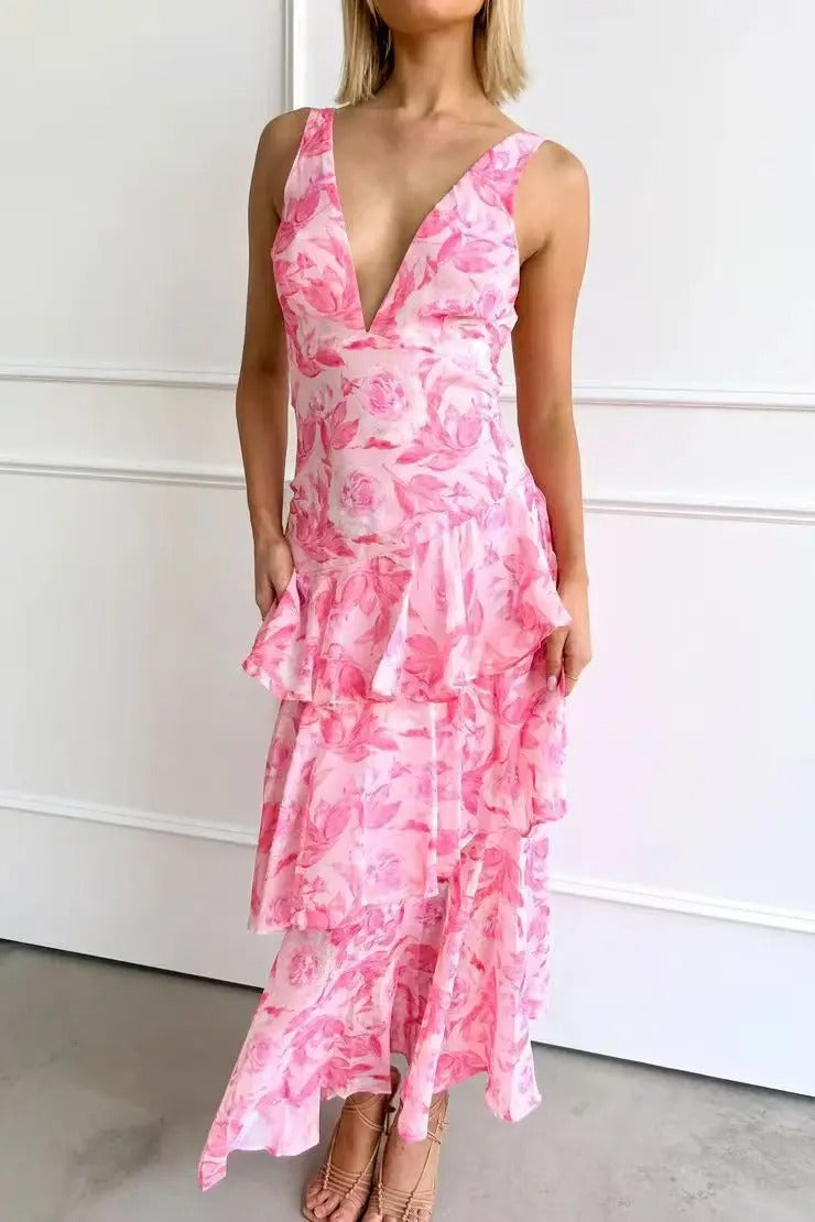 Maxi dress with a deep V-neckline, featuring a flowing silhouette and elegant design. 11