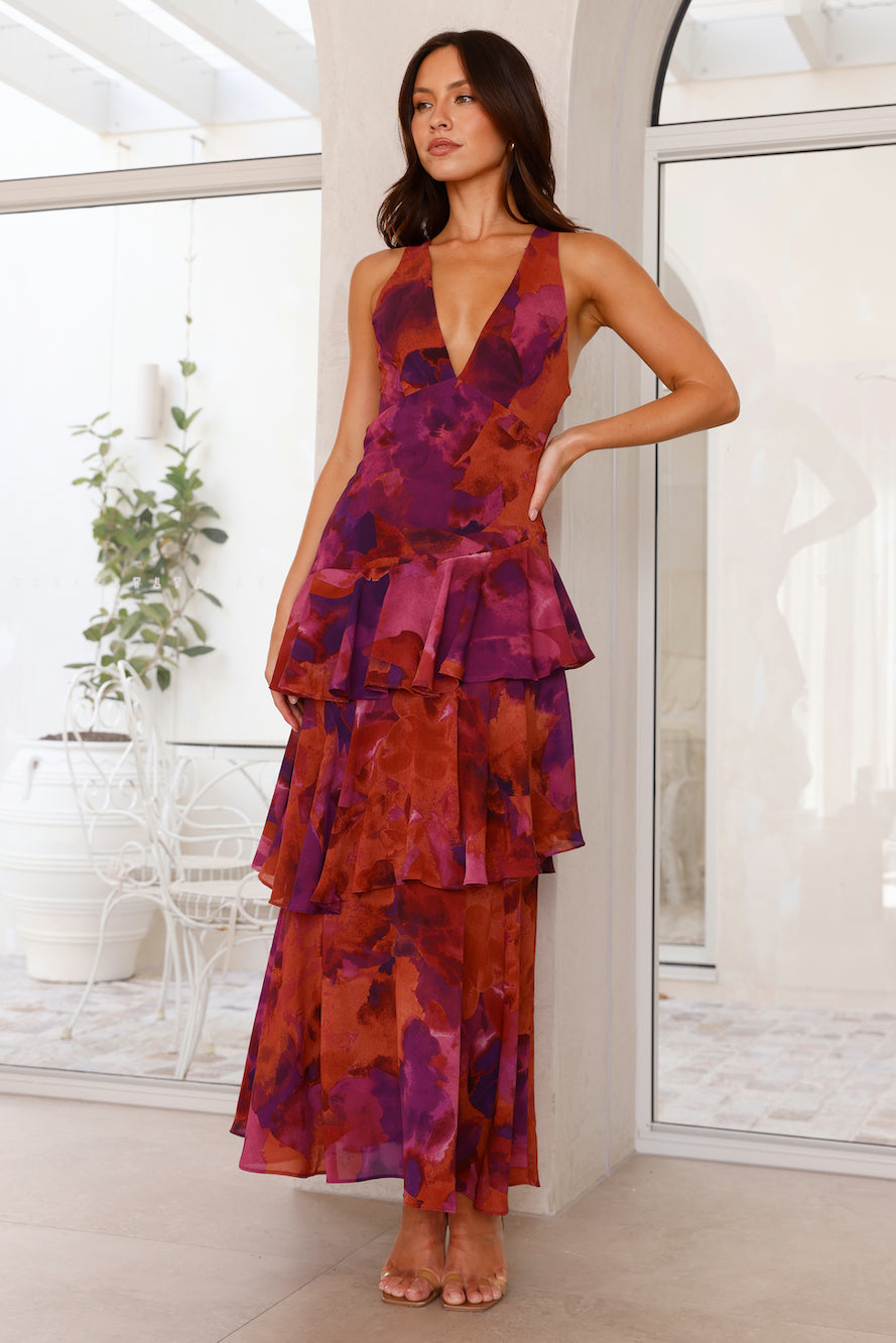 Maxi dress with a deep V-neckline, featuring a flowing silhouette and elegant design. 6