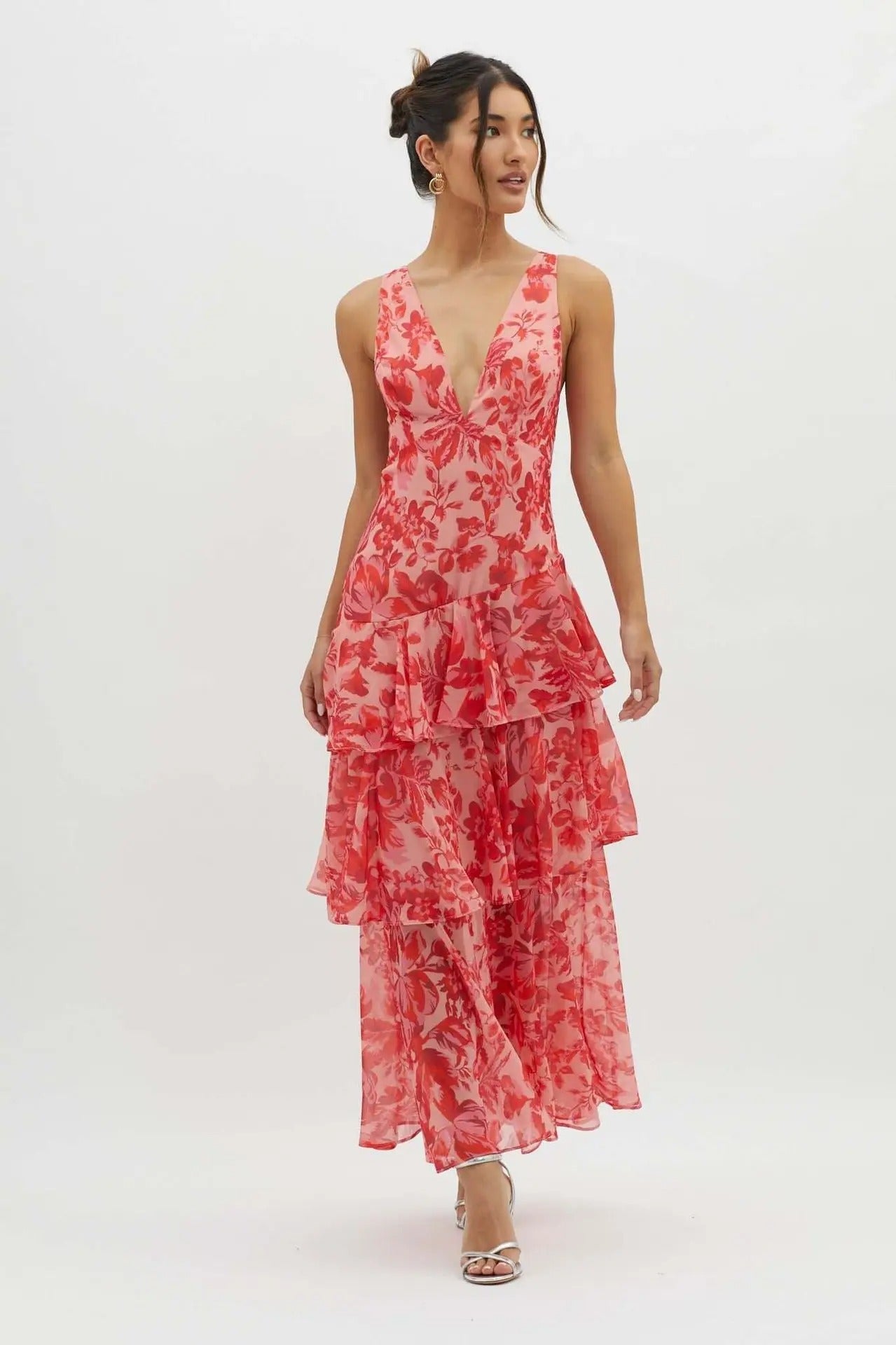 Maxi dress with a deep V-neckline, featuring a flowing silhouette and elegant design. 9