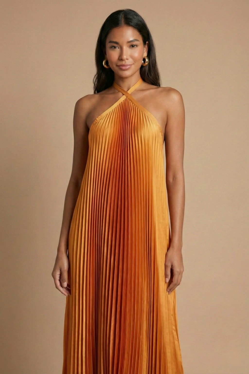 Maxi dress with pleats and an open back, designed for formal occasions such as weddings. 2