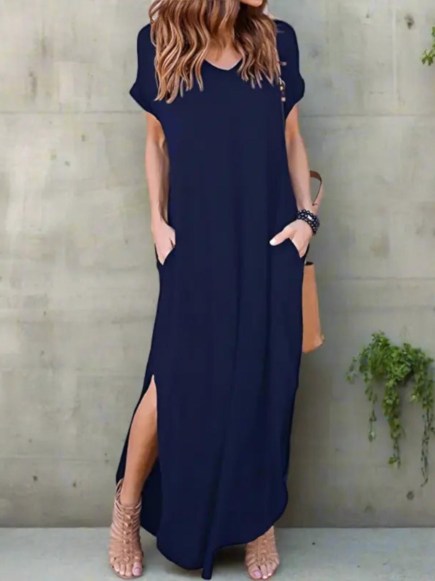 Maxi T-shirt dress featuring a V-neckline and a side slit, designed for summer wear. 1