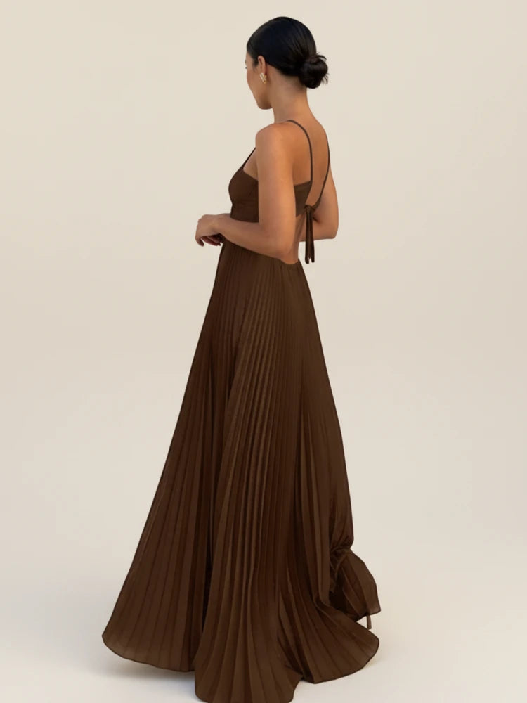 Maxi dress with a halter neckline and pleated A-line design, suitable for weddings. 1