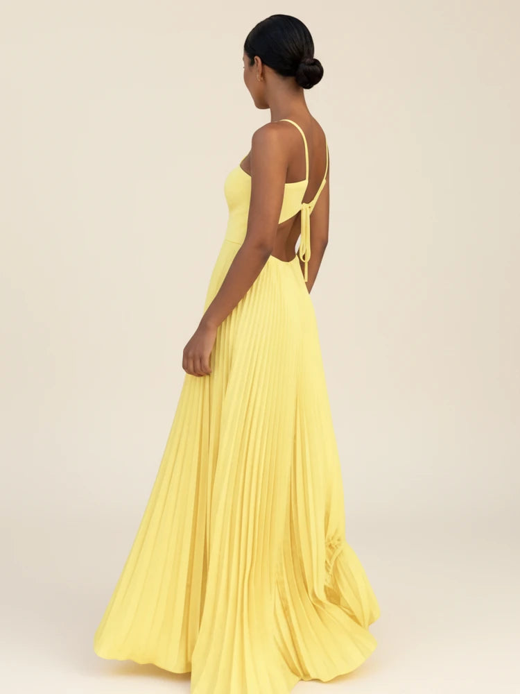 Maxi dress with a halter neckline and pleated A-line design, suitable for weddings. 3