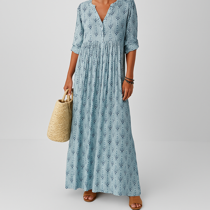 Maxi dress for women featuring a V-neckline and long sleeves, designed for formal occasions such as weddings. 1