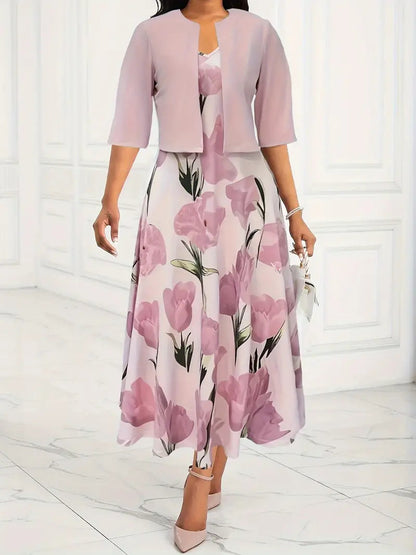 Maxi dress with a floral pattern paired with a fitted blazer, displayed on a mannequin against a neutral background. 0