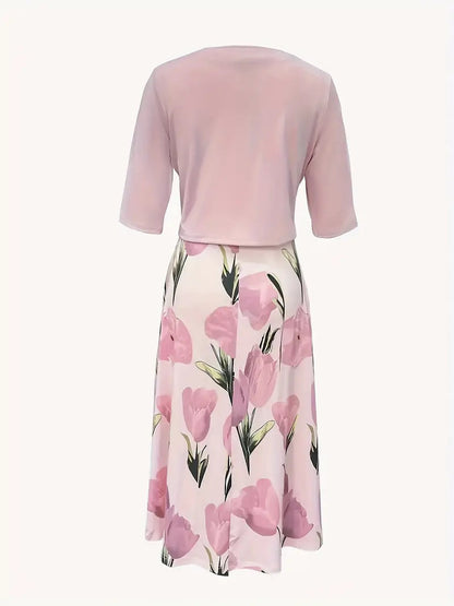 Maxi dress with a floral pattern paired with a fitted blazer, displayed on a mannequin against a neutral background. 2