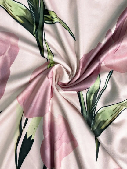 Maxi dress with a floral pattern paired with a fitted blazer, displayed on a mannequin against a neutral background. 4