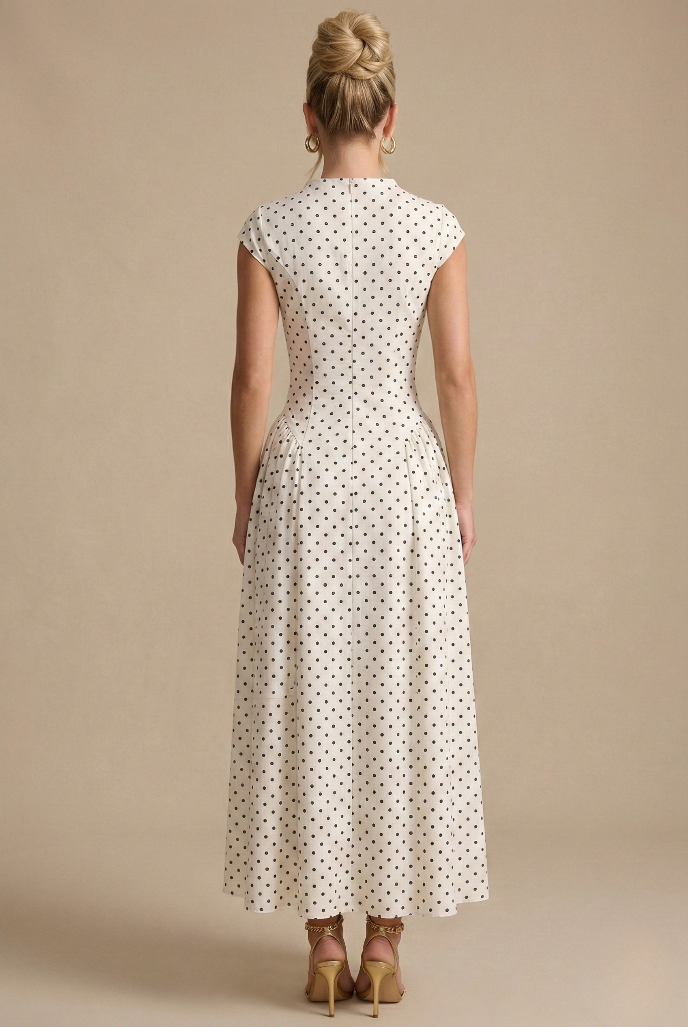 Maxi dress for women featuring a high neckline and sleeves with a hood, designed for formal events such as weddings. 1