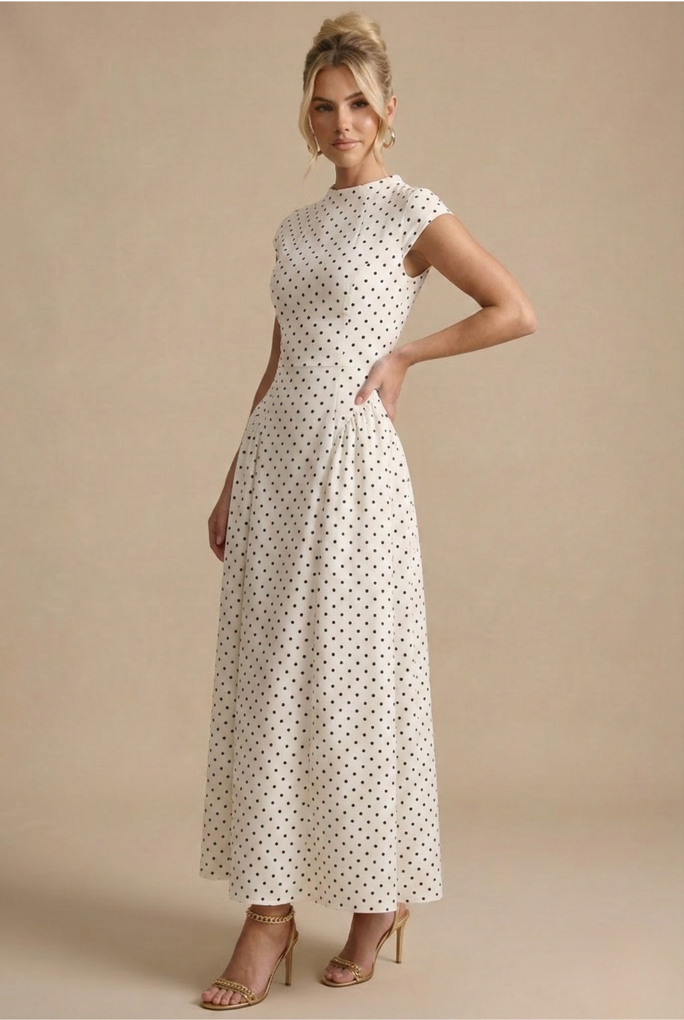 Maxi dress for women featuring a high neckline and sleeves with a hood, designed for formal events such as weddings. 3