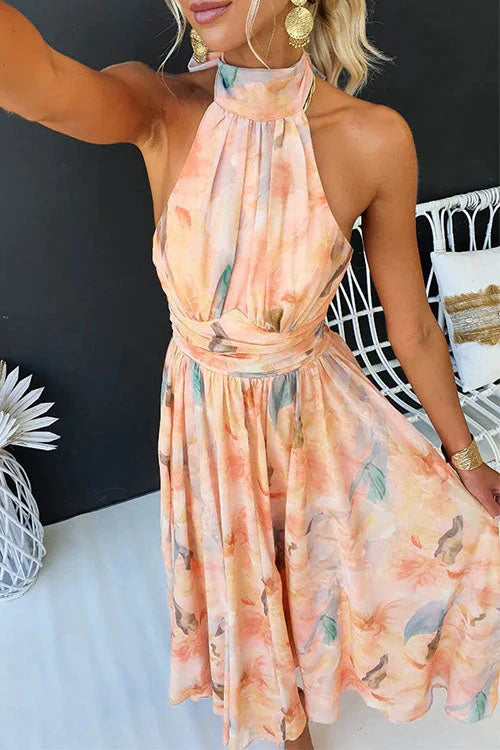 Maxi dress for women featuring a floral pattern and halter neckline, displayed on a mannequin against a neutral background. 3