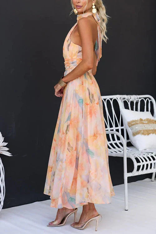 Maxi dress for women featuring a floral pattern and halter neckline, displayed on a mannequin against a neutral background. 4