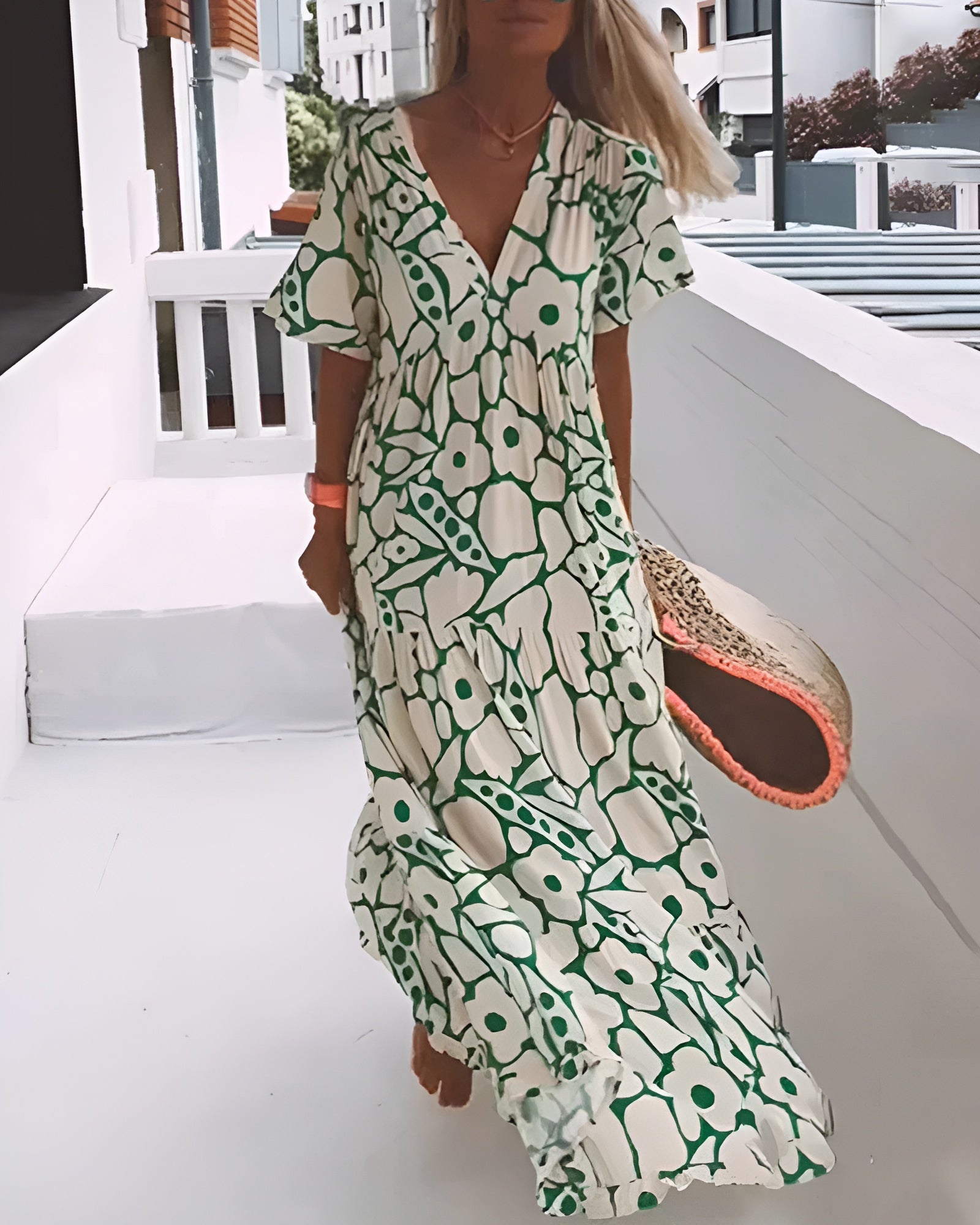Maxi dress featuring a V-neckline and ruffles, designed for summer outings. 0