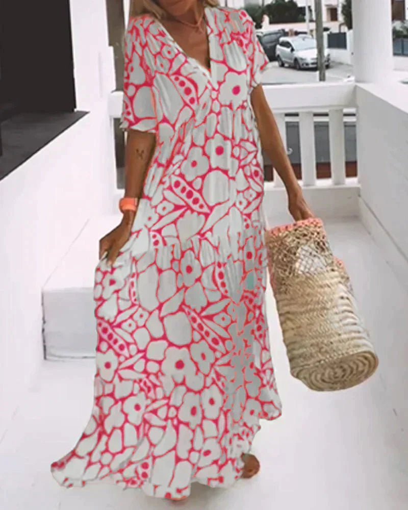 Maxi dress featuring a V-neckline and ruffles, designed for summer outings. 2
