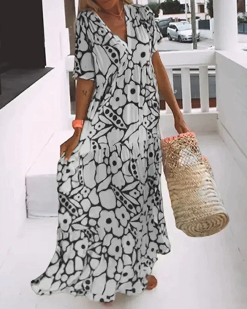 Maxi dress featuring a V-neckline and ruffles, designed for summer outings. 3