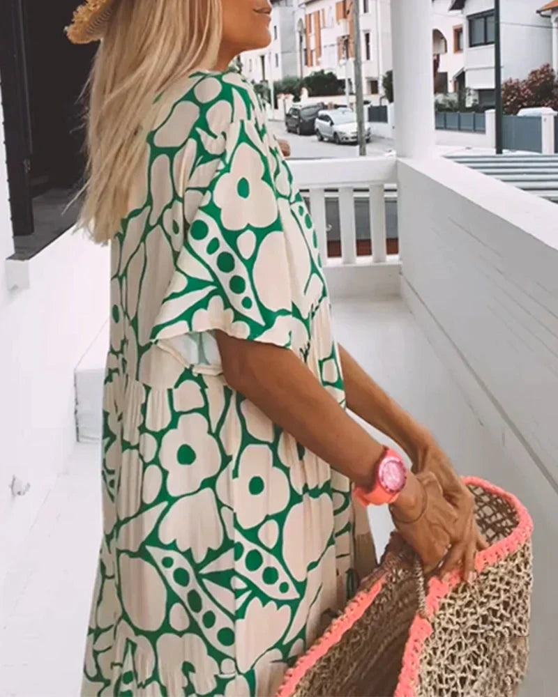 Maxi dress featuring a V-neckline and ruffles, designed for summer outings. 4