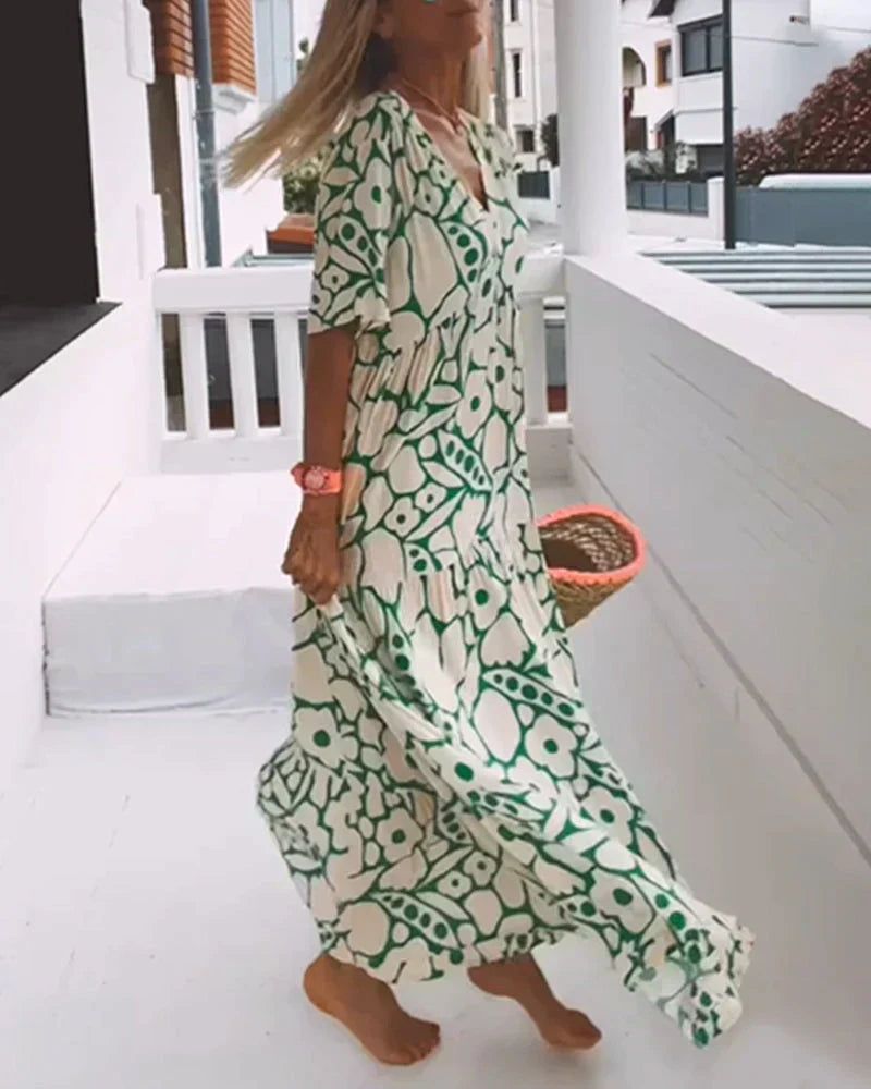 Maxi dress featuring a V-neckline and ruffles, designed for summer outings. 5
