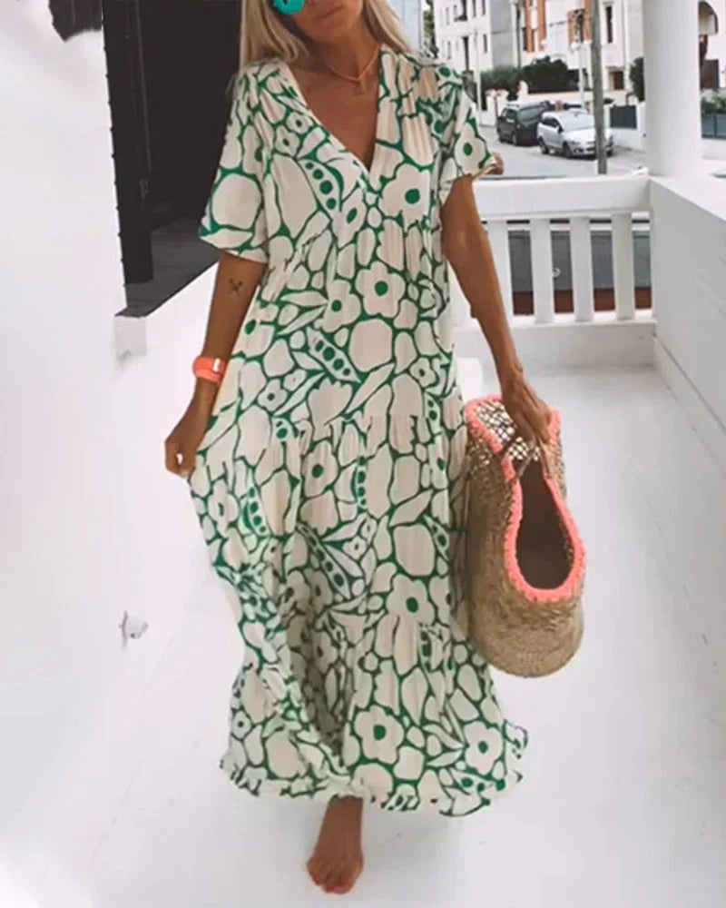 Maxi dress featuring a V-neckline and ruffles, designed for summer outings. 6